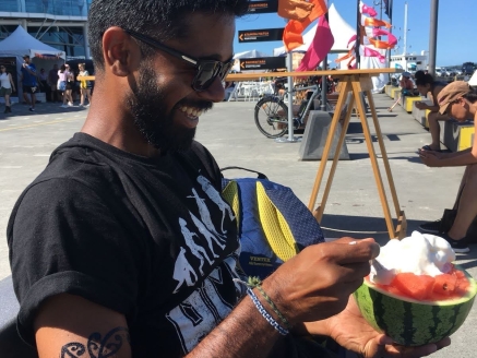A young man eating ice cream in a watermelon near Auckland