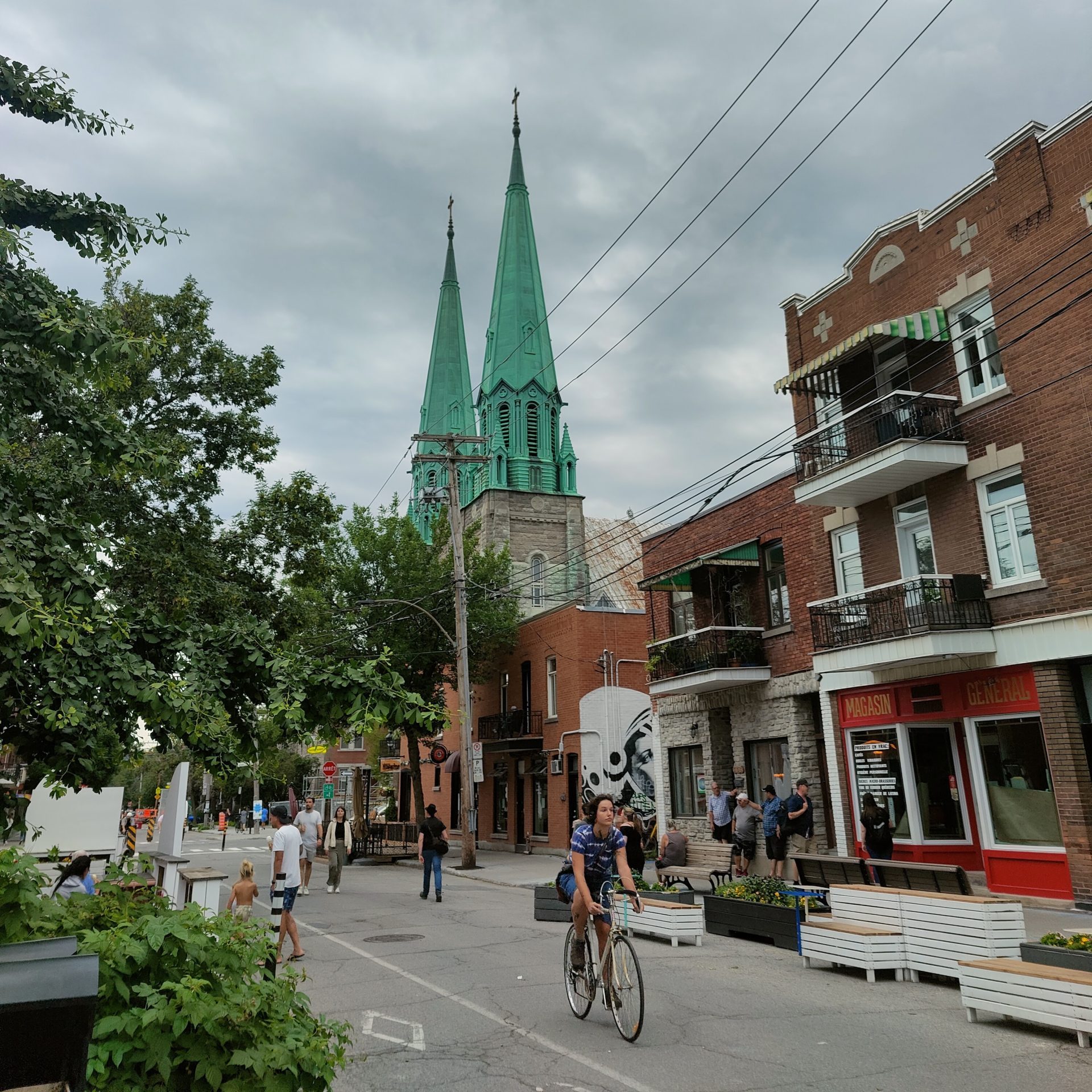 A cyclist passing through a pedestrian priority street in Montreal