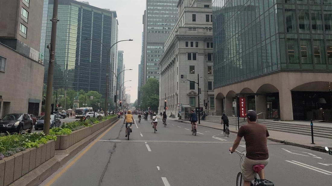 A cyclist riding through downtown Montreal